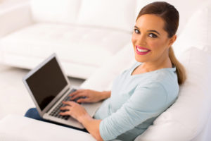 Young Woman With Laptop Computer